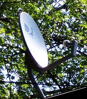 A DIRECTVsatellite dish on a roof